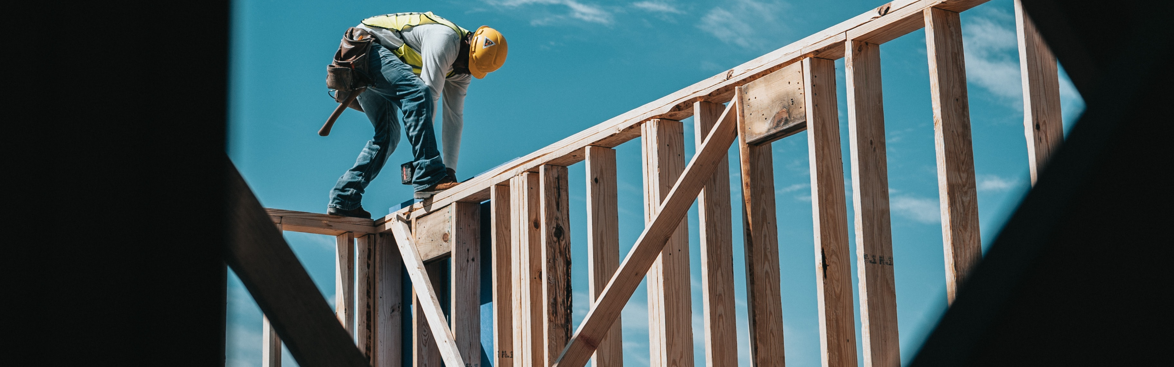 A construction worker working on a high platform.